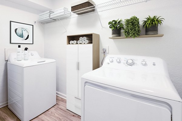 Laundry room with energy-efficient washers and dryers at North Hill Apartments