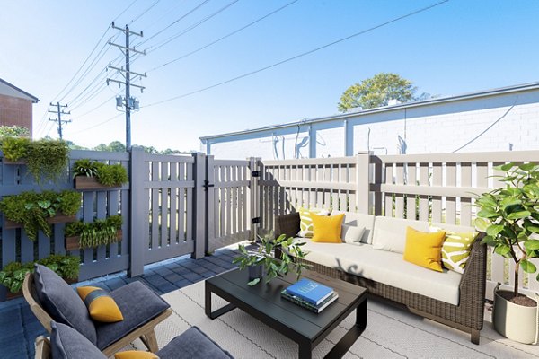 Patio at North Hill Apartments featuring comfortable seating and garden views