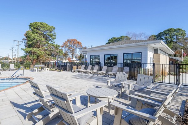 Resort-style pool with cabanas at North Hill Apartments offering luxury relaxation