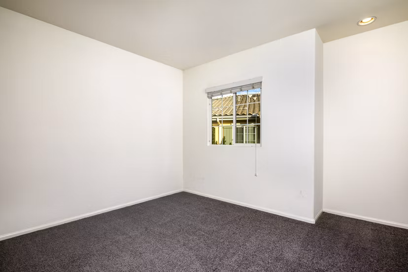 Spacious bedroom with modern furnishings at Jackson Pointe 111 Apartments