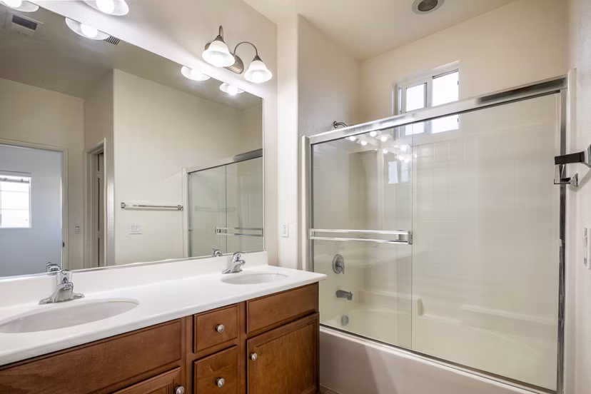 Bathroom with modern fixtures and elegant tiling at Jackson Pointe 111 Apartments