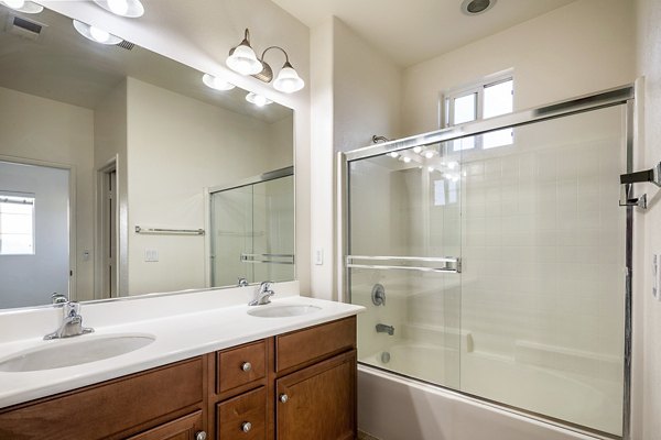 Bathroom with modern fixtures and elegant tiling at Jackson Pointe 111 Apartments