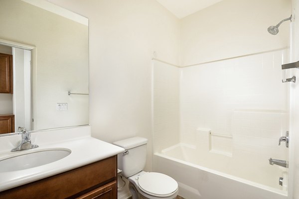Modern bathroom with sleek fixtures and marble countertops at Jackson Pointe 111 Apartments