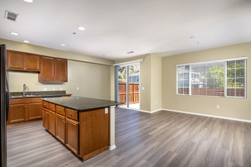 Spacious kitchen featuring modern appliances and granite countertops in Jackson Pointe 111 Apartments