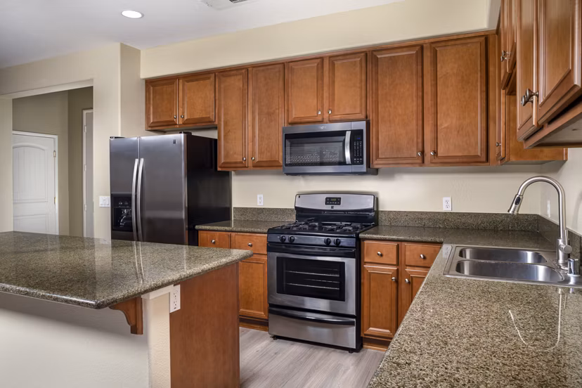 Modern kitchen with stainless steel appliances at Jackson Pointe 111 Apartments