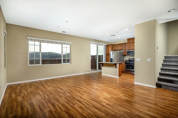 Spacious living room with modern furnishings at Jackson Pointe 111 Apartments