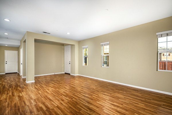 Contemporary living room with modern furnishings at Jackson Pointe 111 Apartments