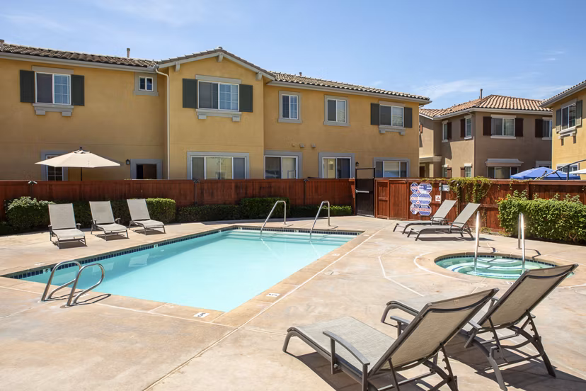 Luxurious pool with lounge seating at Jackson Pointe 111 Apartments, perfect for relaxation and recreation