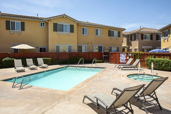 Luxurious pool with lounge seating at Jackson Pointe 111 Apartments, perfect for relaxation and recreation