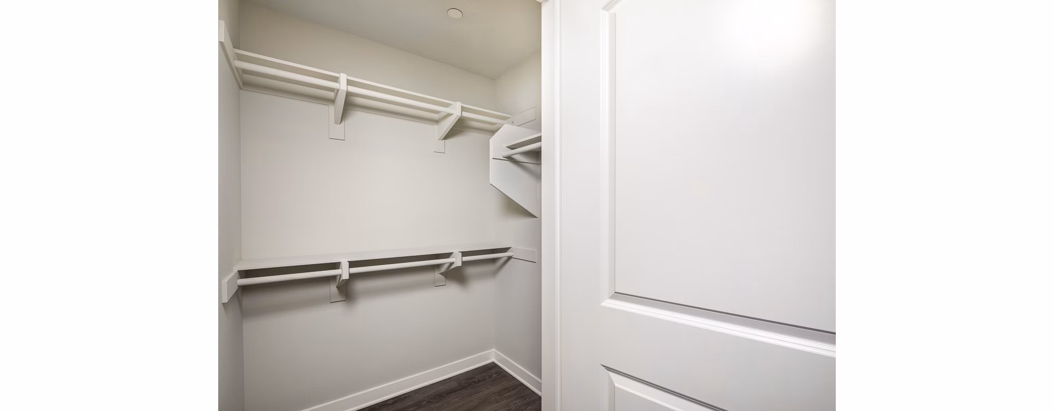 Walk-in closet with custom shelving at Lakeview 88 Apartments, luxury living space designed for organization and style