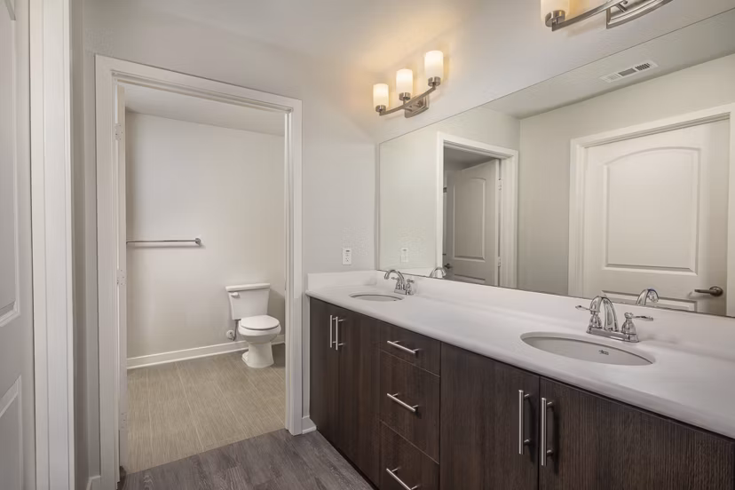 Bathroom with elegant marble countertops and modern lighting at Lakeview 88 Apartments, a luxury living space enhancing resident comfort and style