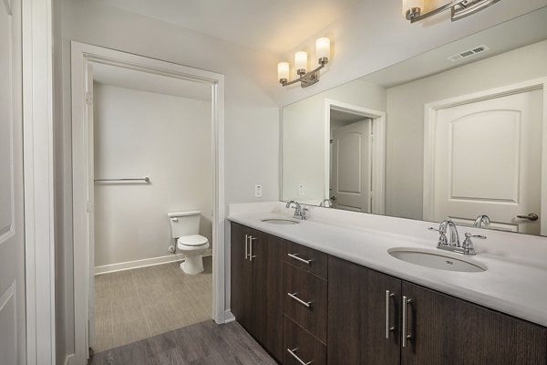 Bathroom with elegant marble countertops and modern lighting at Lakeview 88 Apartments, a luxury living space enhancing resident comfort and style
