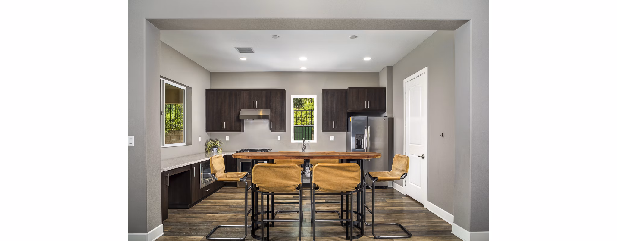 Dining area with modern furnishings and large windows in Lakeview 88 Apartments