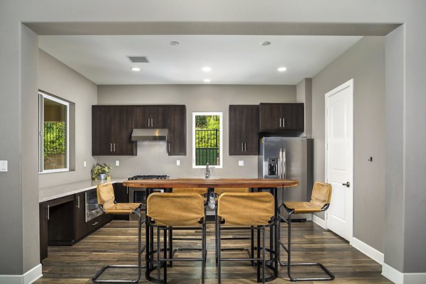 Dining area with modern furnishings and large windows in Lakeview 88 Apartments