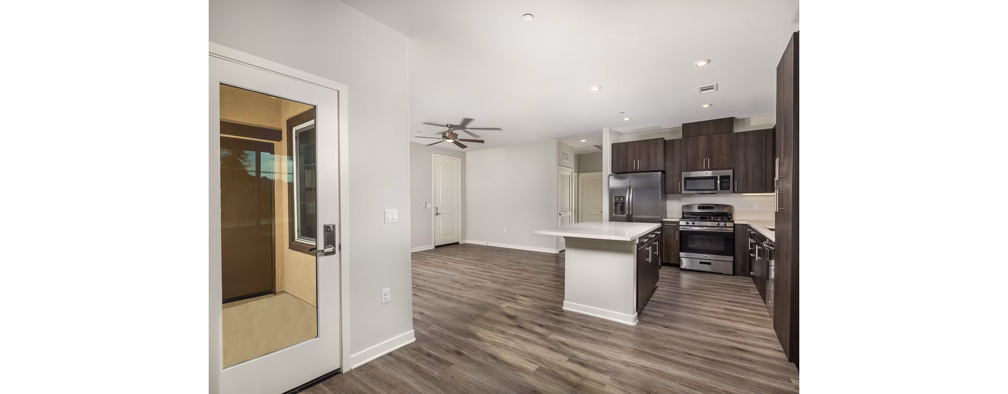 Spacious kitchen with modern appliances and island at Lakeview 88 Apartments