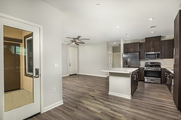 Spacious kitchen with modern appliances and island at Lakeview 88 Apartments