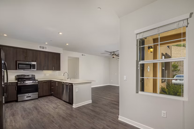 Cozy dining area with modern chandelier in Lakeview 88 Apartments