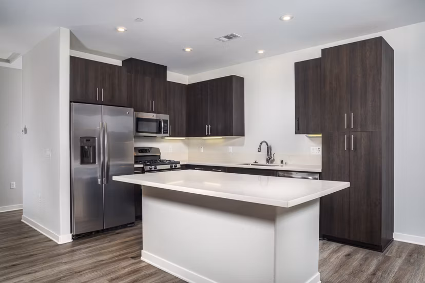 Luxurious kitchen with stainless steel appliances and granite countertops in Lakeview 88 Apartments