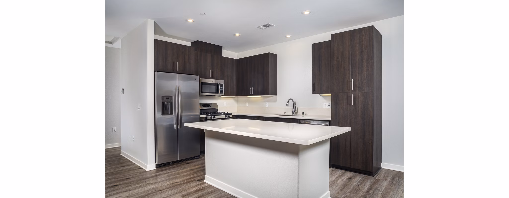 Luxurious kitchen with stainless steel appliances and granite countertops in Lakeview 88 Apartments