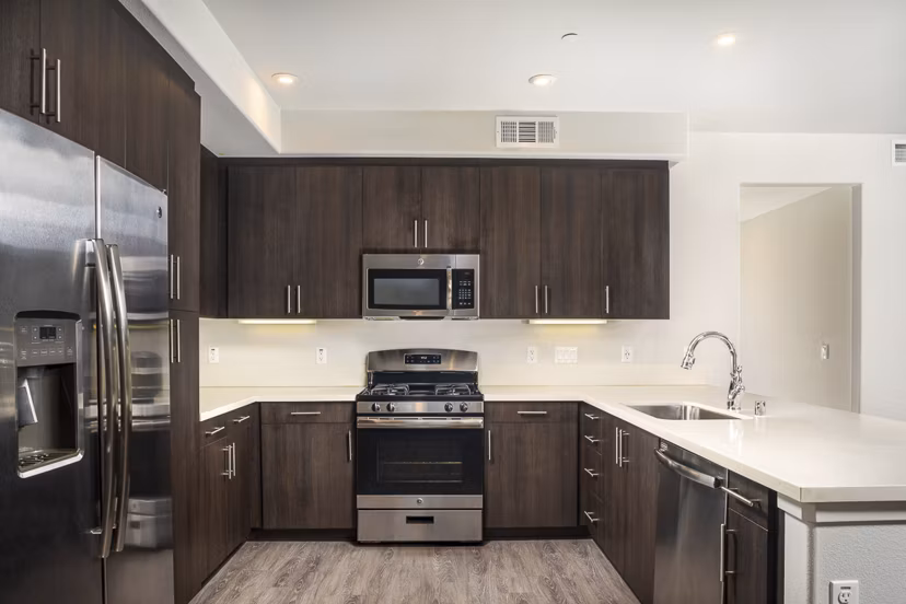 Modern kitchen with stainless steel appliances in Lakeview 88 Apartments