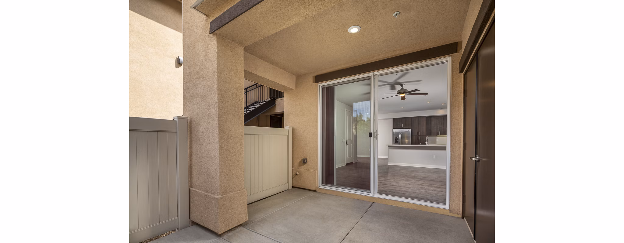 Spacious outdoor patio with modern seating at Lakeview 88 Apartments, perfect for relaxation and entertaining guests