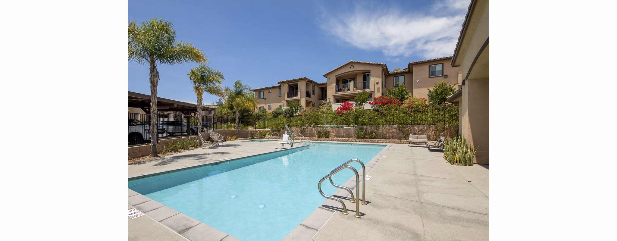 Luxe outdoor pool with sundeck at Lakeview 88 Apartments