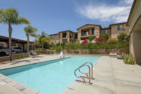 Luxe outdoor pool with sundeck at Lakeview 88 Apartments