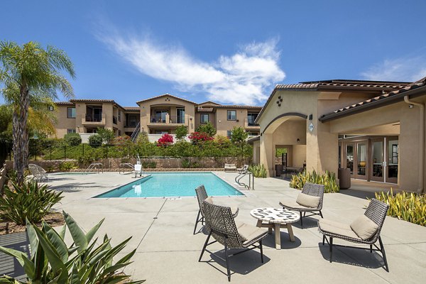 Relaxing poolside area with comfortable lounge chairs at Lakeview 88 Apartments