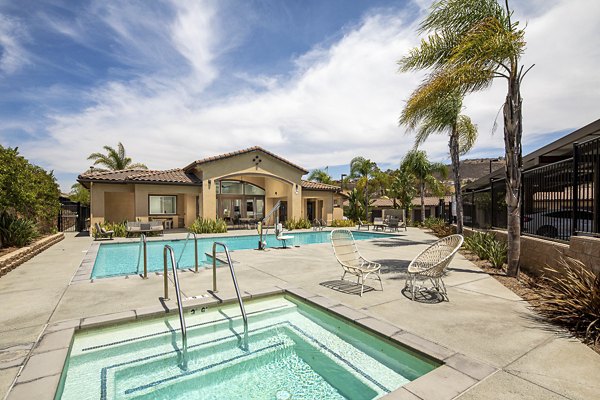 Resort-style pool with lounge chairs at Lakeview 88 Apartments, perfect for relaxation in luxury surroundings