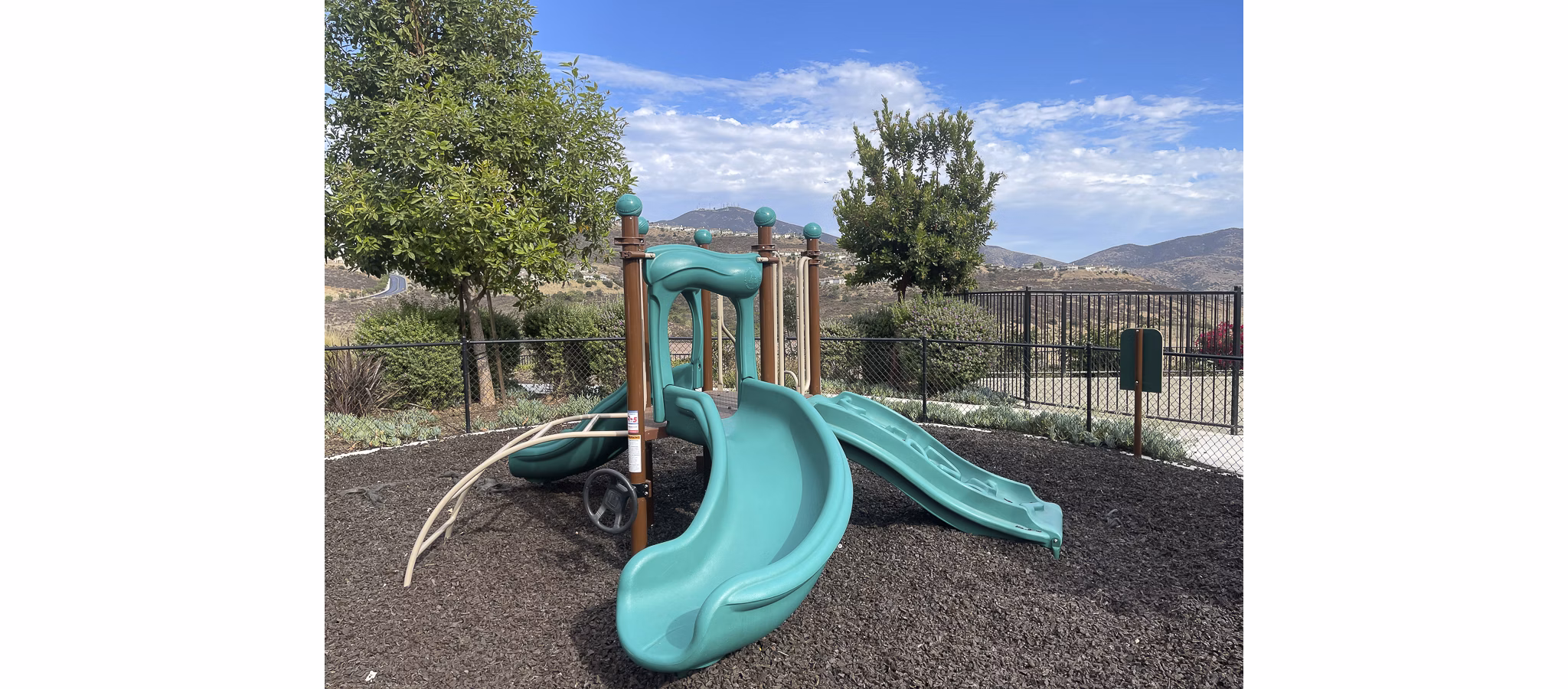 Colorful playground with slides and swings at Lakeview 88 Apartments, offering family-friendly amenities in a welcoming community environment