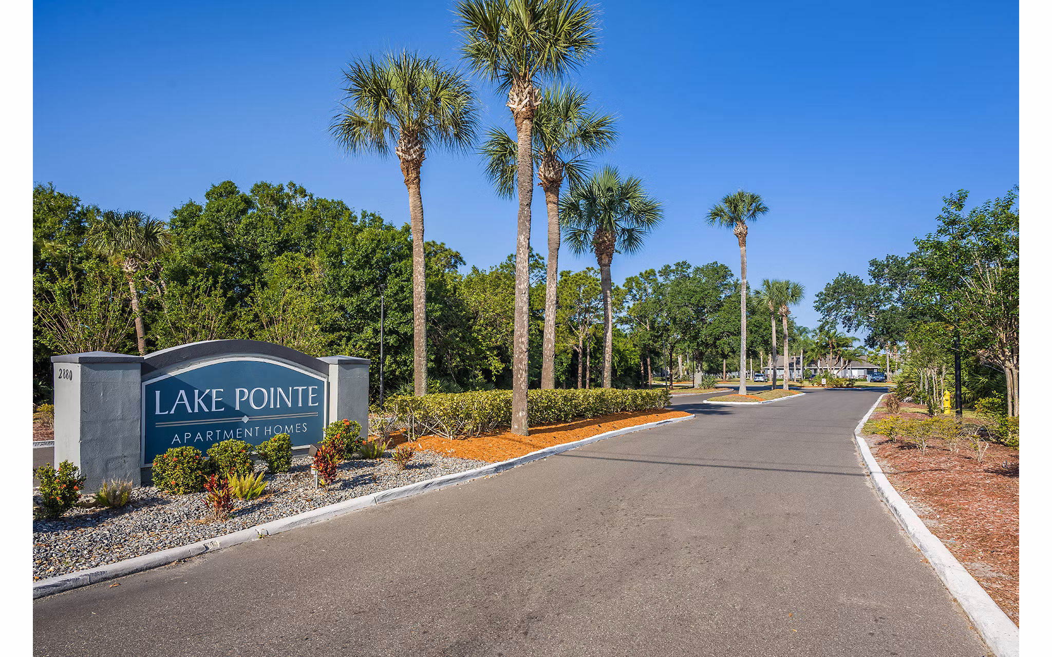 Entrance signage at Lake Pointe Apartments, luxury living community with modern amenities