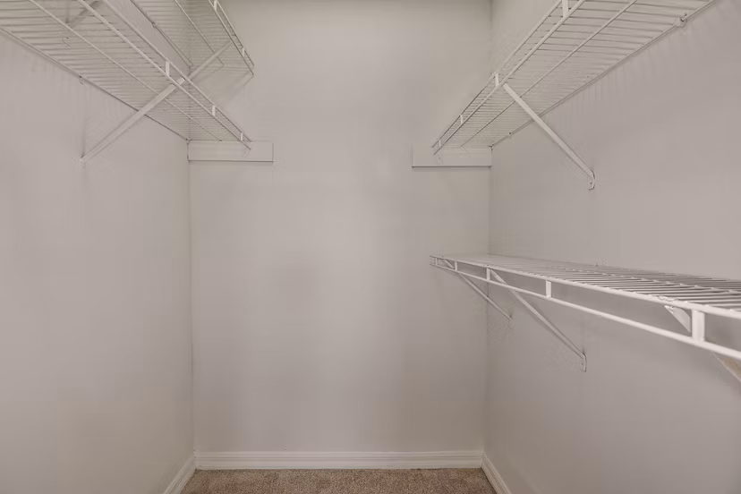 Spacious closet with modern shelving in Lake Pointe Apartments