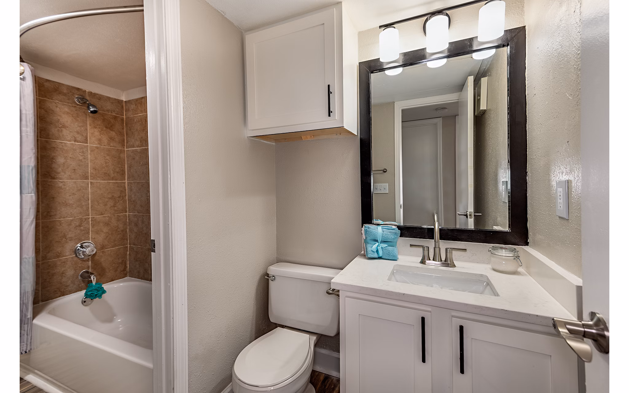 Bathroom with sleek fixtures and granite countertops in Lake Pointe Apartments