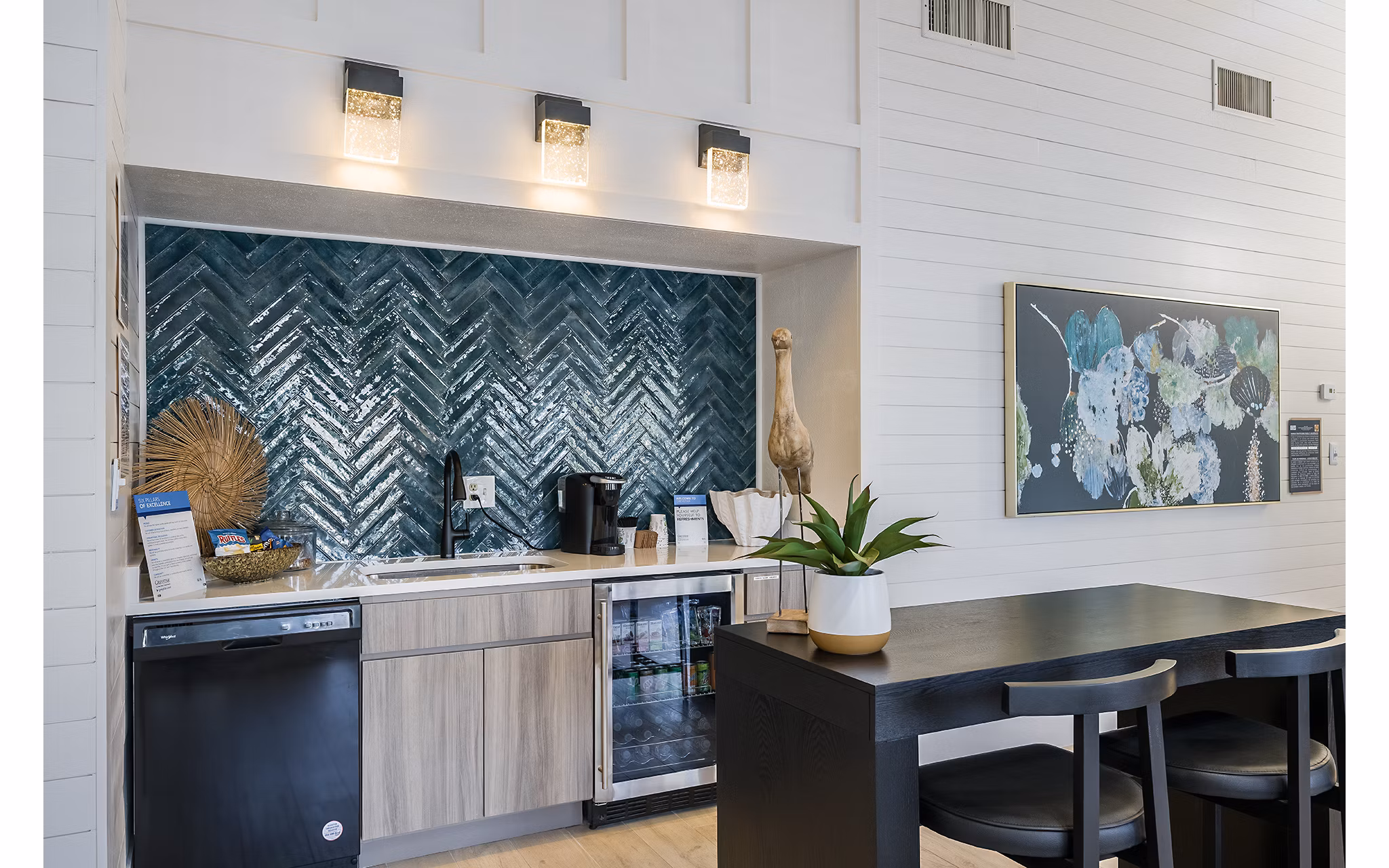 Modern clubhouse featuring comfortable seating and large windows at Lake Pointe Apartments in luxury Greystar community