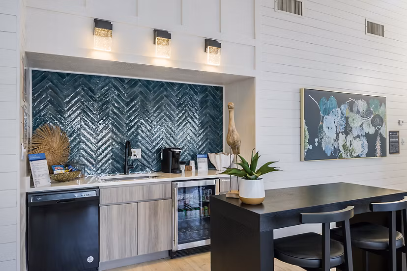 Modern clubhouse featuring comfortable seating and large windows at Lake Pointe Apartments in luxury Greystar community
