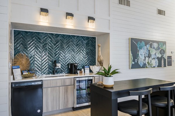 Modern clubhouse featuring comfortable seating and large windows at Lake Pointe Apartments in luxury Greystar community
