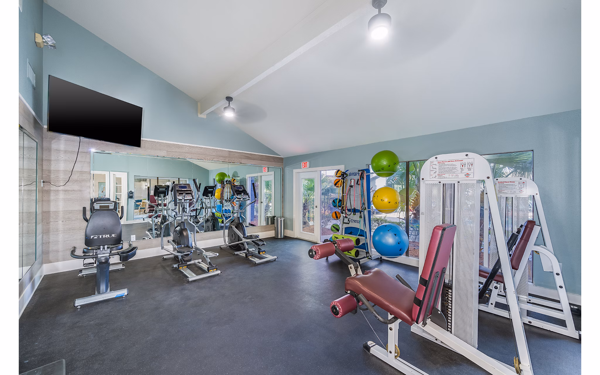 Fitness center at Lake Pointe Apartments: Modern exercise equipment in a spacious setting