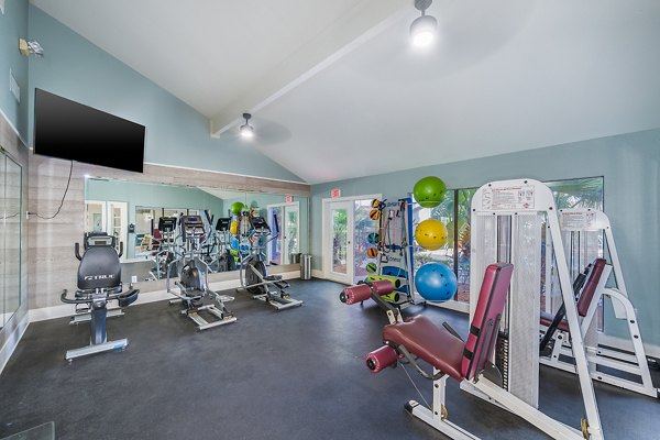 Fitness center at Lake Pointe Apartments: Modern exercise equipment in a spacious setting