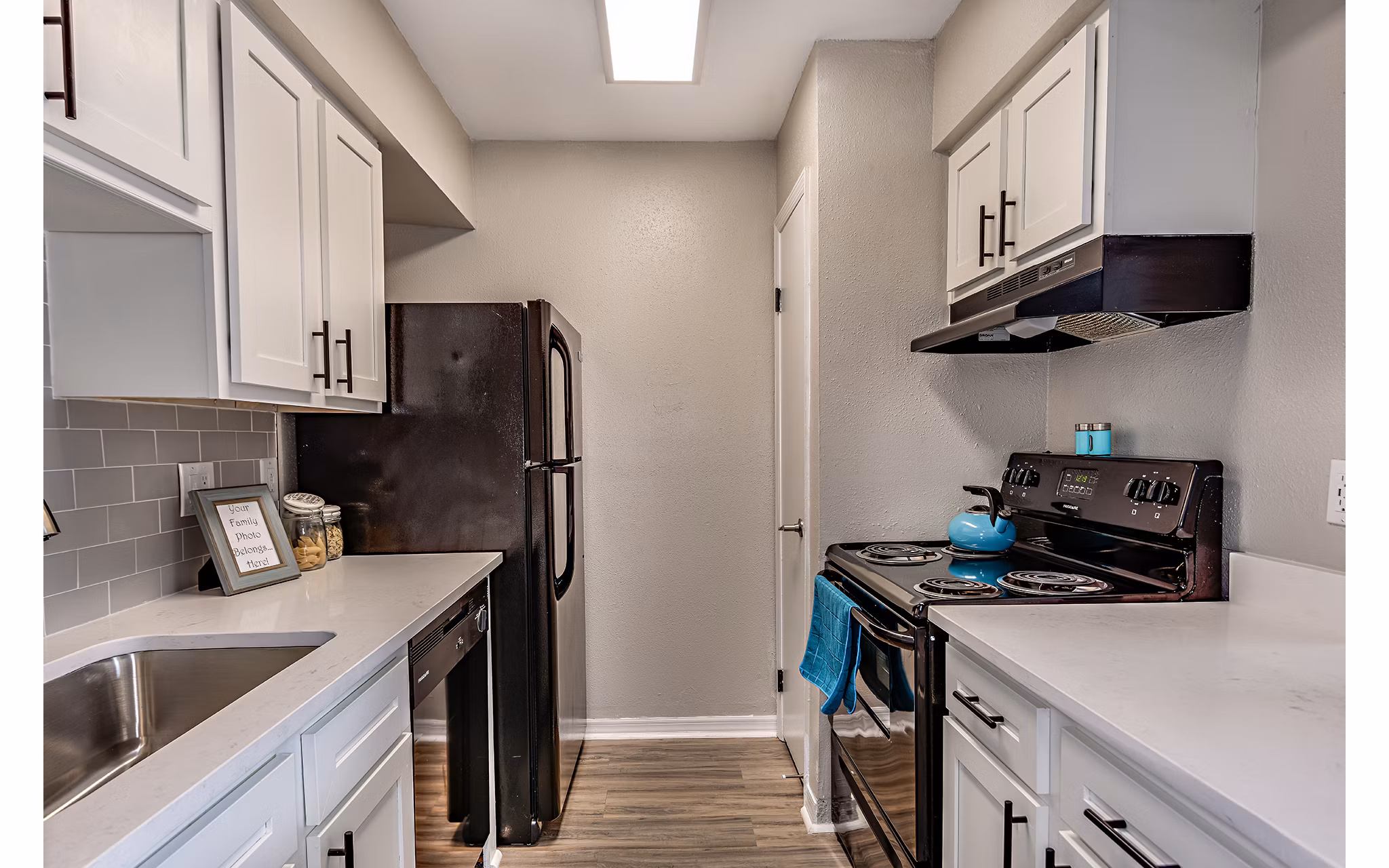 Modern kitchen with stainless steel appliances in Lake Pointe Apartments