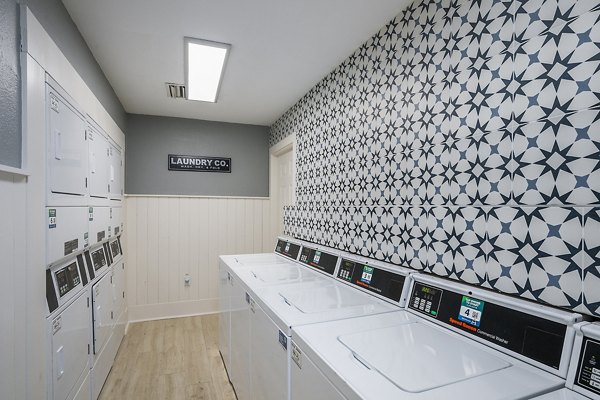 Efficient laundry facility at Lake Pointe Apartments with modern washers and dryers, ensuring convenience for residents
