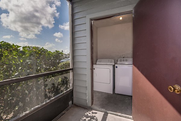 Patio with comfortable seating at Lake Pointe Apartments in a serene lakeside setting
