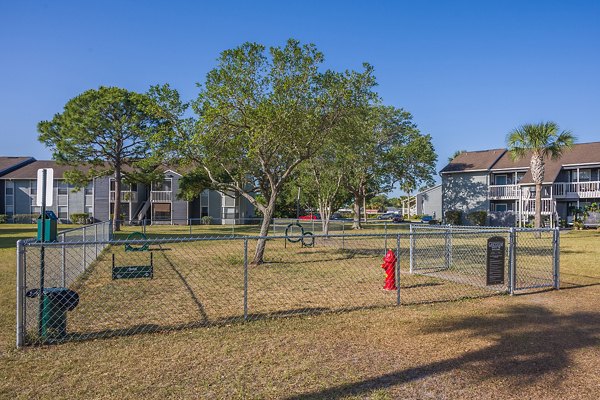 Dog park with agility equipment at Lake Pointe Apartments, perfect for pet-friendly living in a vibrant community
