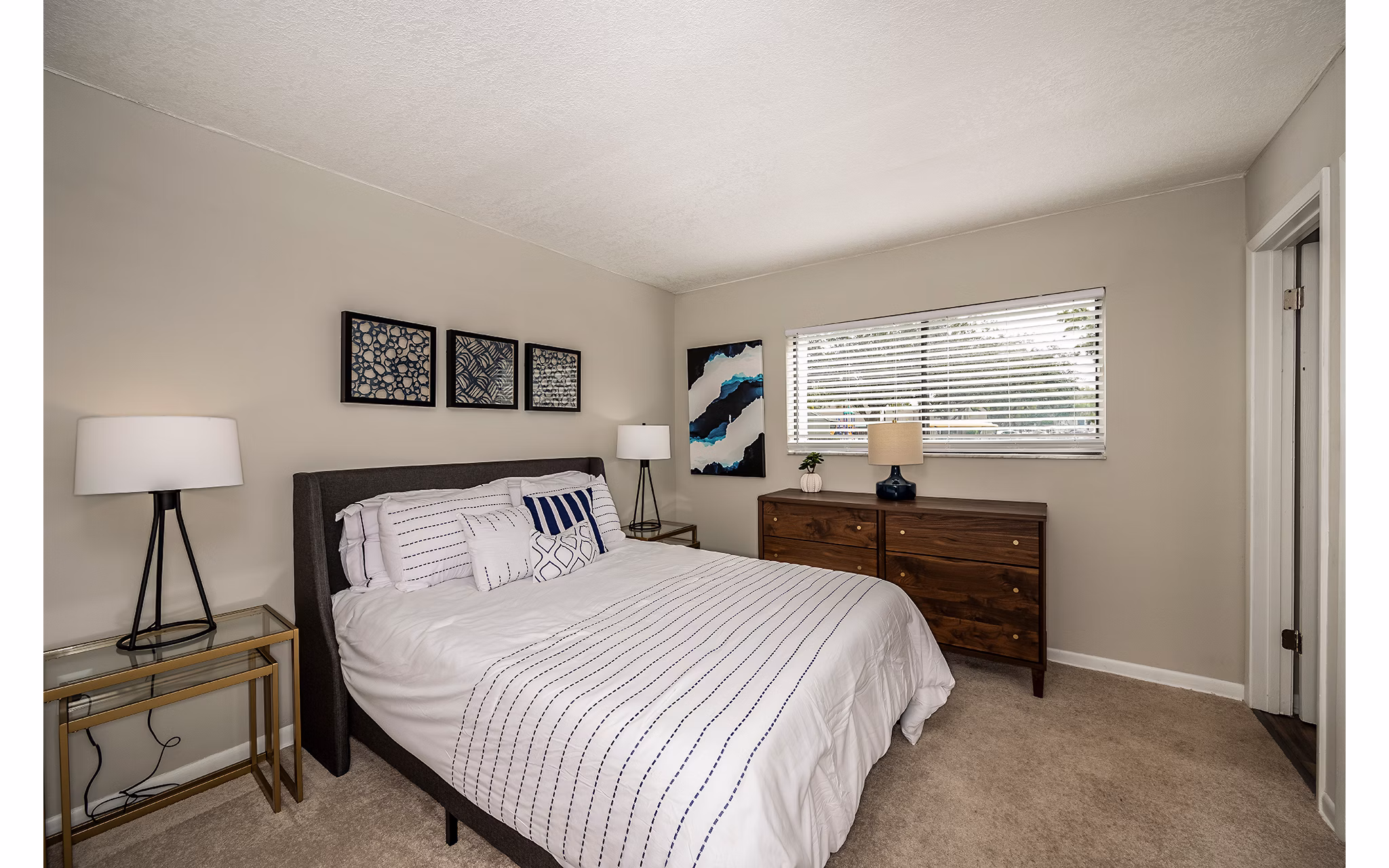 Cozy bedroom with chic decor at The Vinyards Apartments