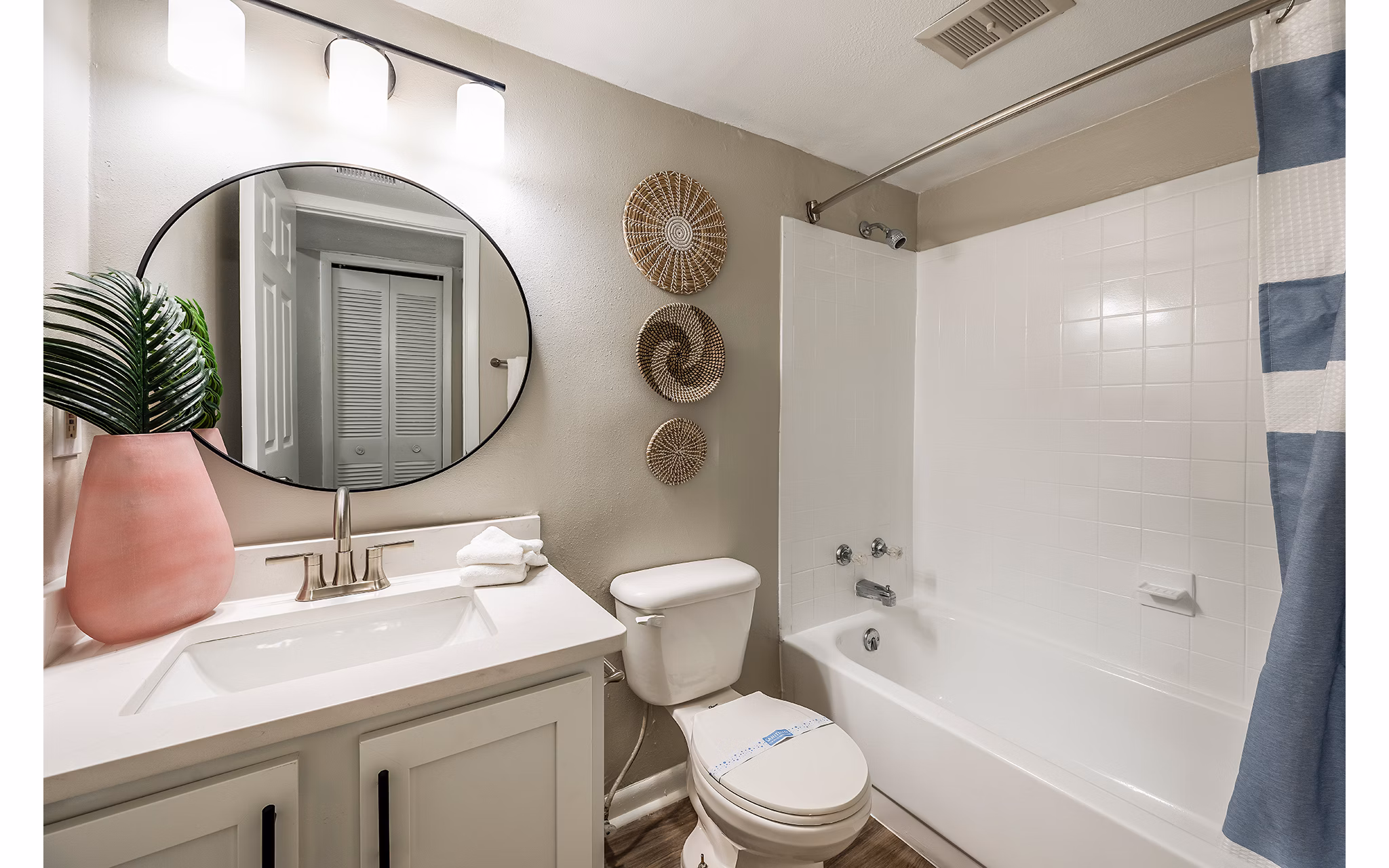 Bathroom featuring elegant marble countertops at The Vinyards Apartments