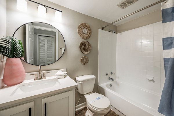 Bathroom featuring elegant marble countertops at The Vinyards Apartments