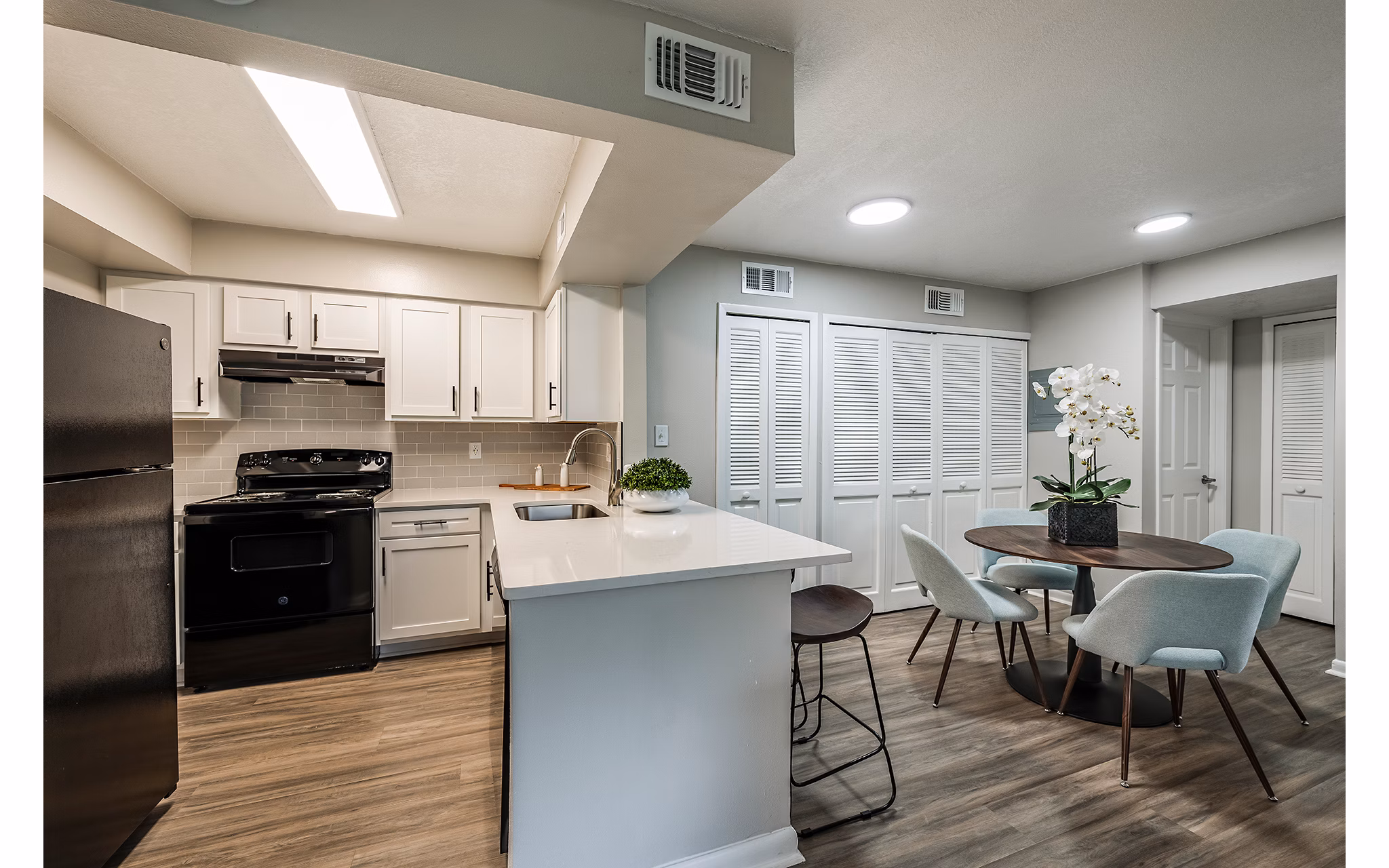 Modern kitchen with stainless steel appliances at The Vinyards Apartments