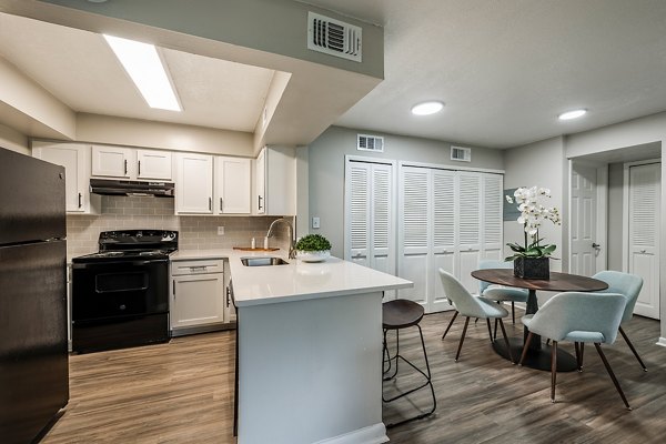 Modern kitchen with stainless steel appliances at The Vinyards Apartments