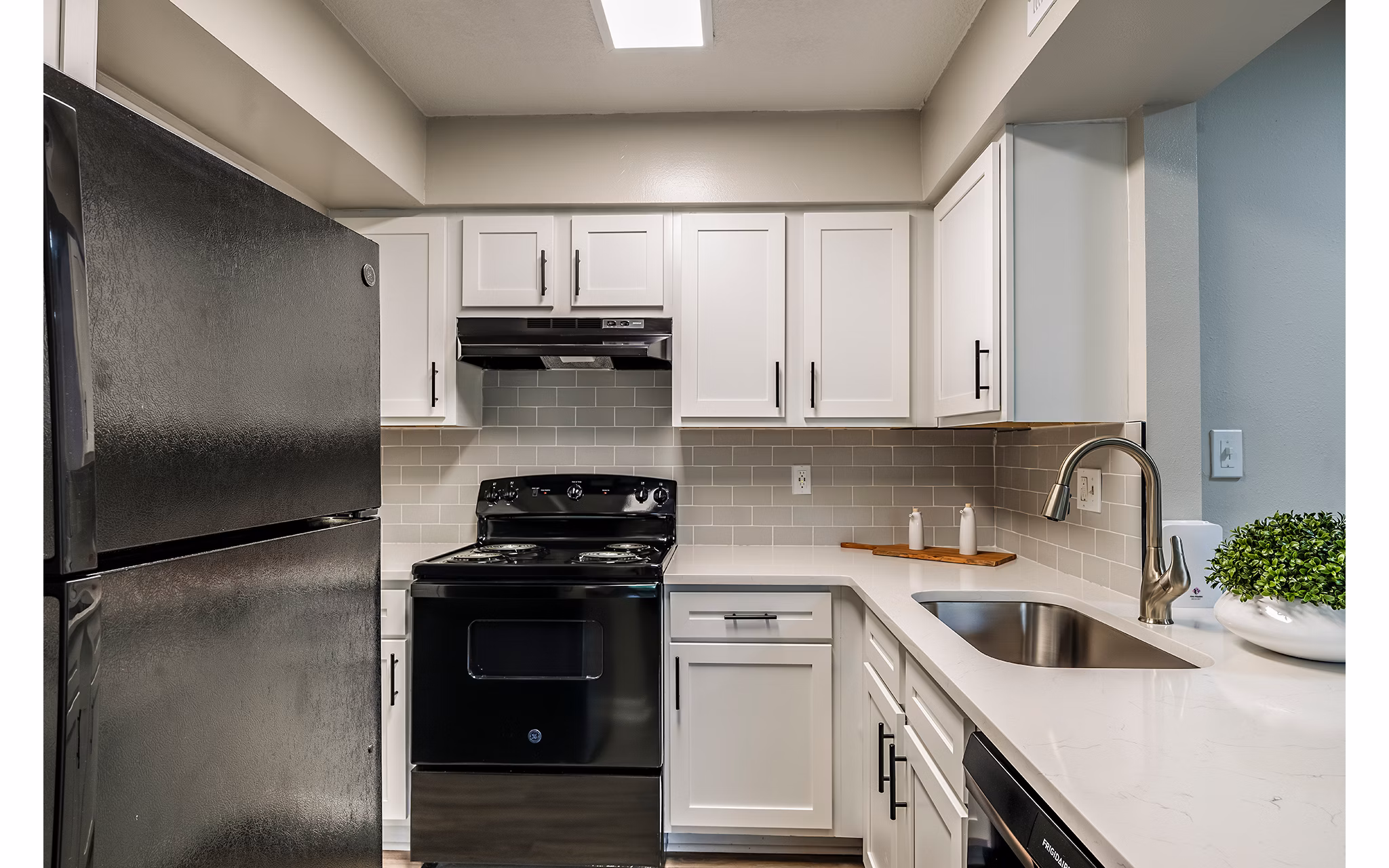 Modern kitchen with stainless steel appliances at The Vinyards Apartments, offering luxury living spaces and elegant design