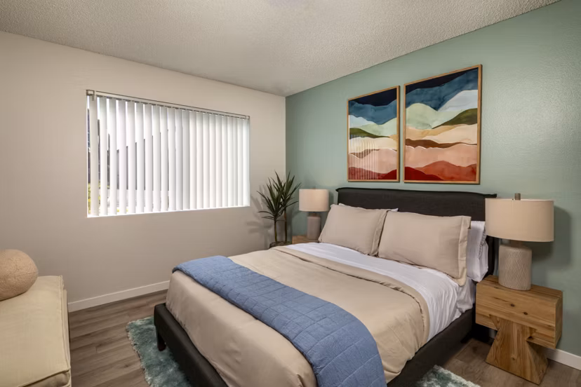 Modern bedroom with cozy decor at Windscape Village Apartments in Greystar's luxurious property portfolio