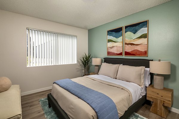 Modern bedroom with cozy decor at Windscape Village Apartments in Greystar's luxurious property portfolio